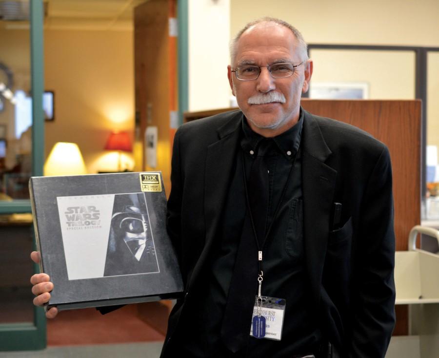 Librarian Joseph Kloss holds the Star Wars Laserdisc. 