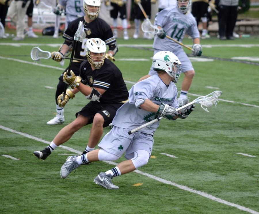 Freshman Sam Crusha (28) assisted Keyan McQueen’s goal late in the fourth quarter against Lindenwood University in a close ECAC conference 8-7 loss.  