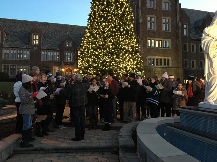 The Concert Choir, under the baton of Thomas Brooks, performs at the tree-lighting ceremony. 