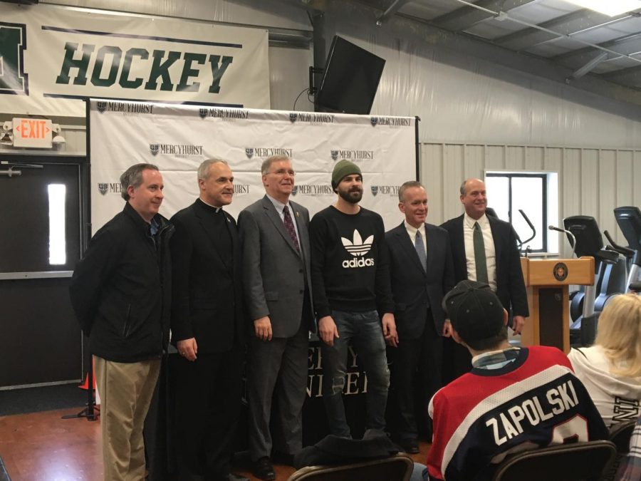 From left are Bill Flanagan and the Rev. Scott Jabo, of Cathedral Prep; Erie Mayor Joseph Schember; Ryan Zapolski, Class of 2011; President Michael T. Victor; and head men’s ice hockey coach Rick Gotkin.