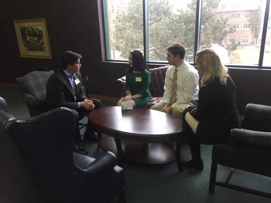 Trustee Lev Kubiak, left, speaks with students, from left, Noelle Zesky, Austin Shinhearl and Hannah Gibson at the Board of Trustees Student Meet and Greet on Feb. 17.