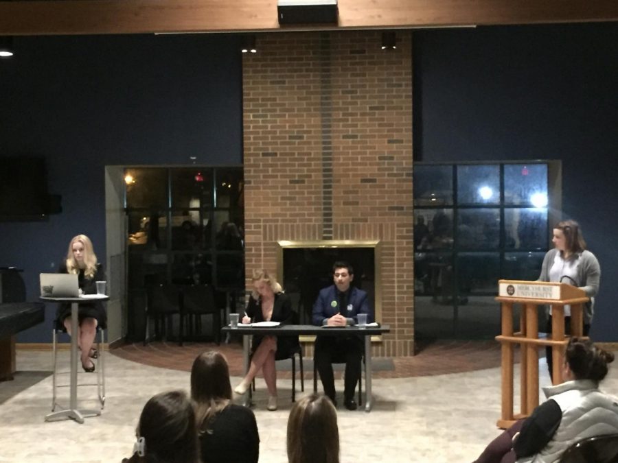 MSG presidential candidates Hannah Gibson and Vince Marrazzo, seated at center, address students about their ideas for the coming year. Sophia Jensen, far left, is running unopposed for vice president.