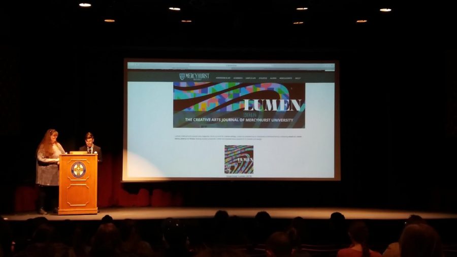 Marnie Sullivan, Ph.D., and Michael Mongera, junior Communication major, unveil Lumen on April 19.
