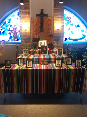 An ofrenda is set up for members of the Mercyhurst community to
leave pictures in memory of loved ones who have passed away. 