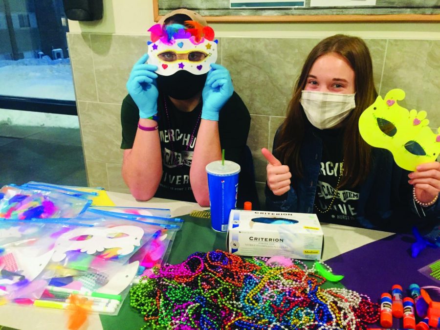 (Left to right) Chris Streibech, Ethan Nannen, Adam Schlereth and
Riley Heeden create Carnaval masks while at the Grotto Commons.