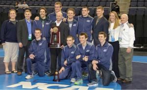 Contributed photo: The wrestling team poses with their fourth-place trophy after the tournament.