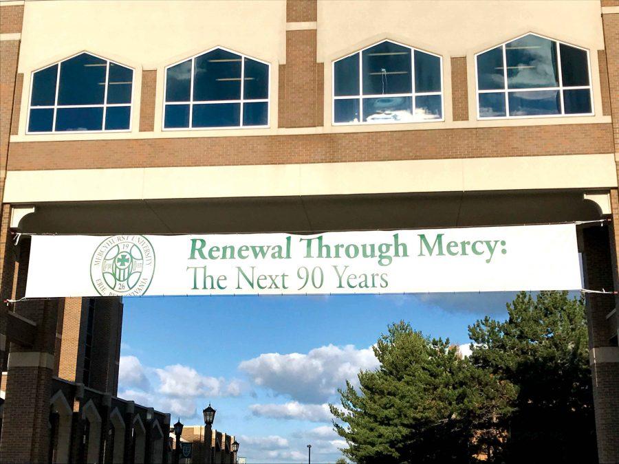A sign hung from the Center for Academic Engagement’s walkway at the front of campus, marking Mercyhurst’s 90th year. 