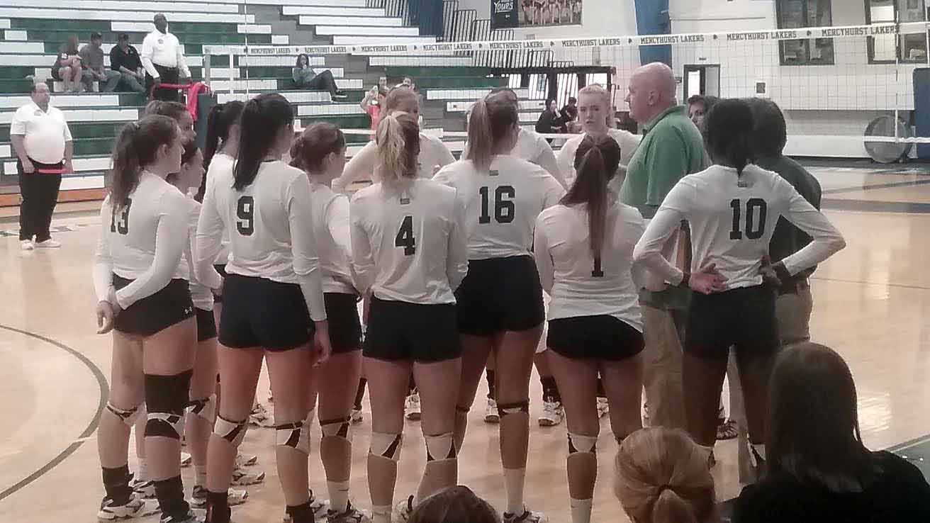 Lakers volleyball Coach Ryan Patton speaks with the team during a timeout.  The Lakers competed against four different schools over the span of Sept. 8-9.