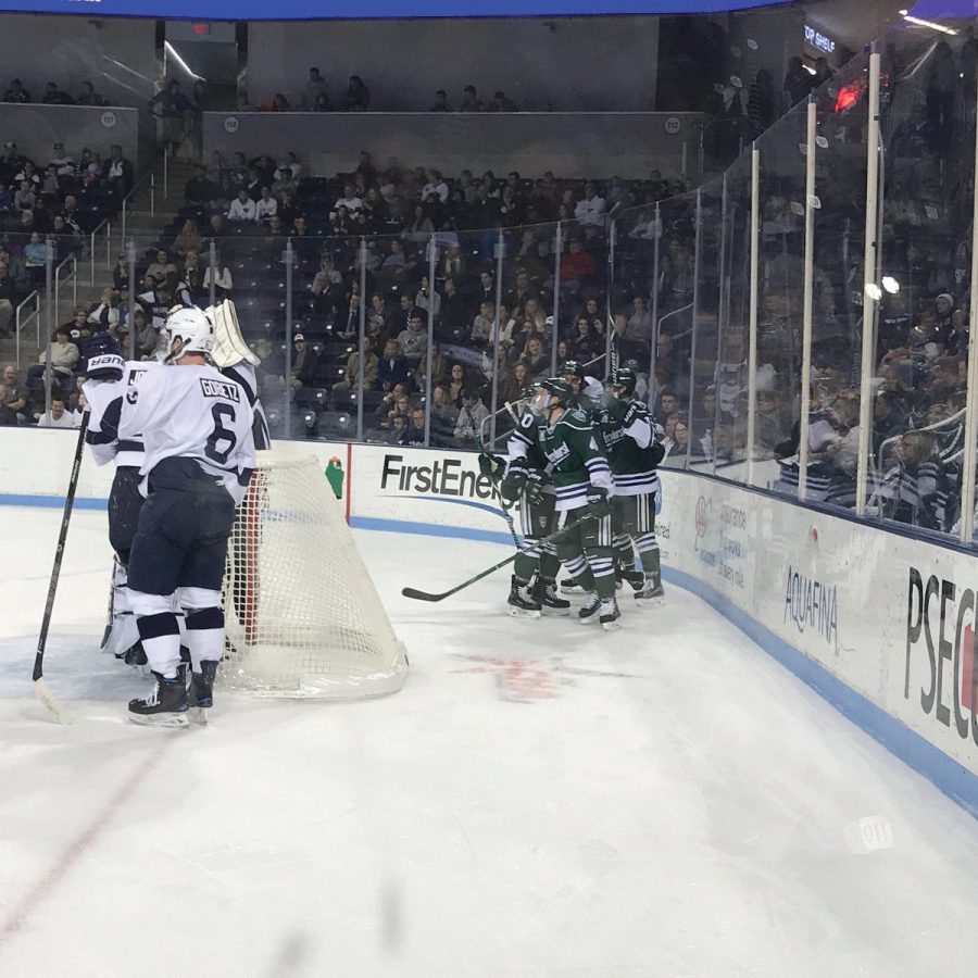 Lakers huddle behind the Penn State net.  The Lakers won 7-4 against Penn State on Nov. 3