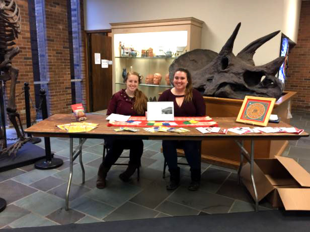 Kaitlyn Kirchmeir and Julia Detota, both sophomore Art Therapy and Psychology double majors, sell cards and prayer flags in Zurn to help raise funds for a trip to work with children in Nepal.