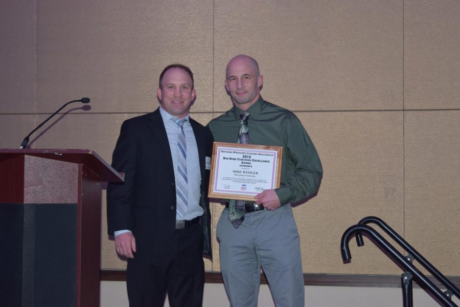 Mercyhurst wrestling head coach Mike Wehler, right, poses with Austin DeVoe, president of the Division II National Wrestling Coaches Association.