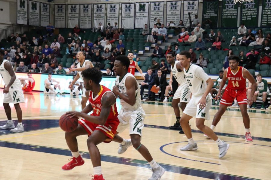 No. 0 MiyKah McIntosh guards against Seton Hill on Saturday, while  No. 13 Edvaldo Ferreira and No. 33 Patrick Smith guard the paint.  The Lakers won against the Griffins 82-58.