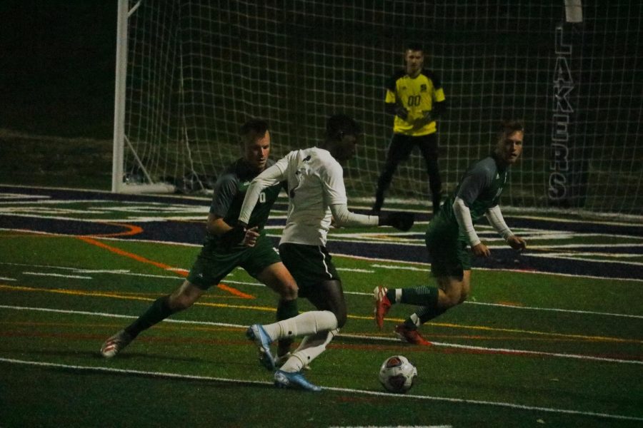 Mercyhurst senior Hady Sarr faces two Slippery Rock players on a breakaway toward goal. The Lakers beat Slippery Rock 1-0 for their Senior Day.